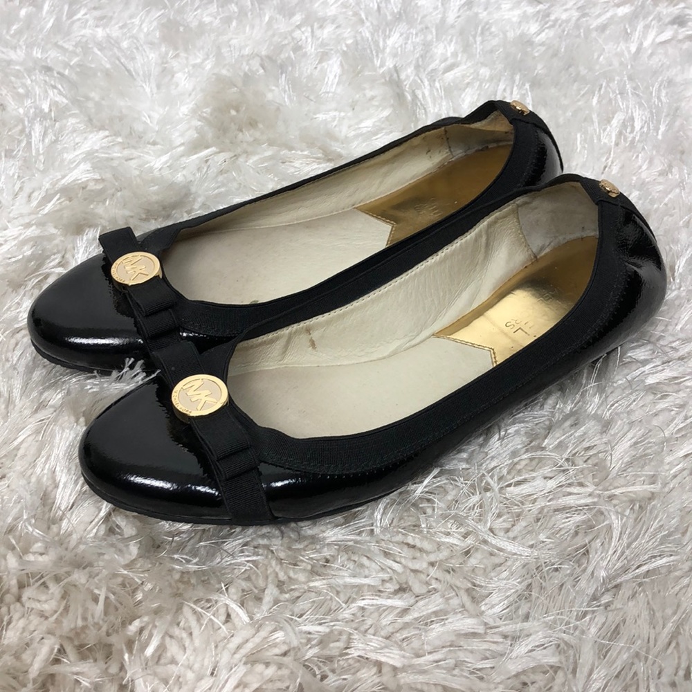 MICHAEL Michael Kors Black Flats with Gold Accents